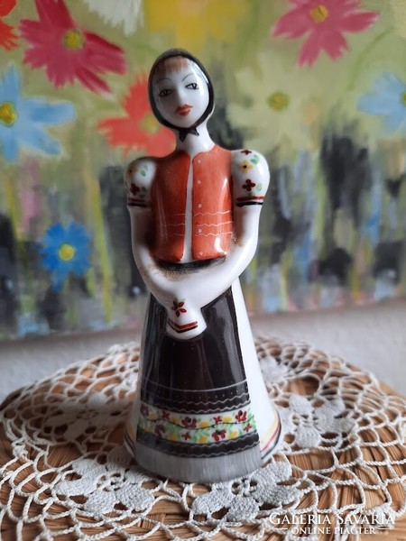 Girl figurine in matyo dress with raven house