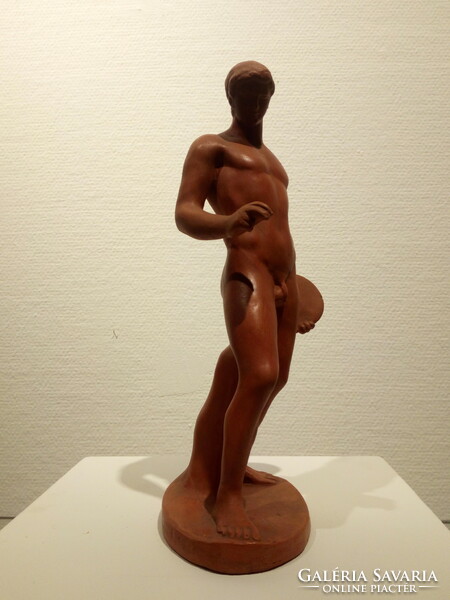 Marked, flawless, discus-throwing nude male terracotta statue