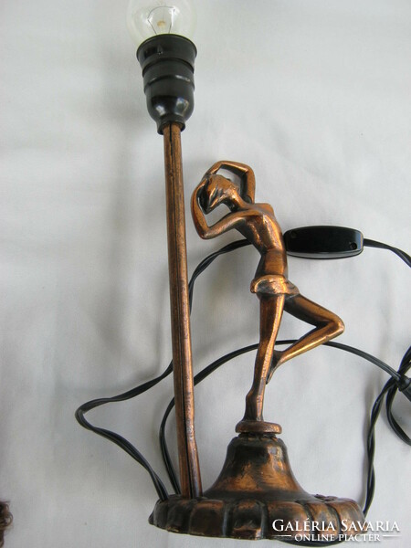 Female nude with metal lamp