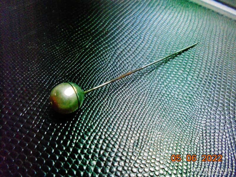 Antique hat with pearls in metal socket