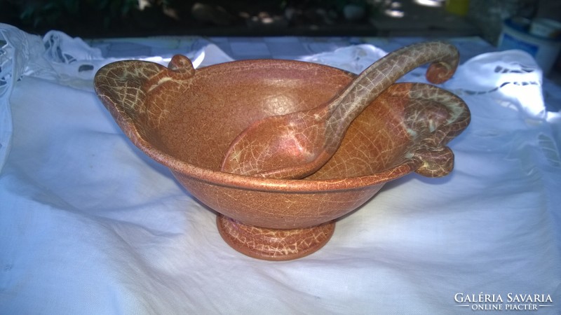 Roman style sauce-serving bowl with spoon on table decoration