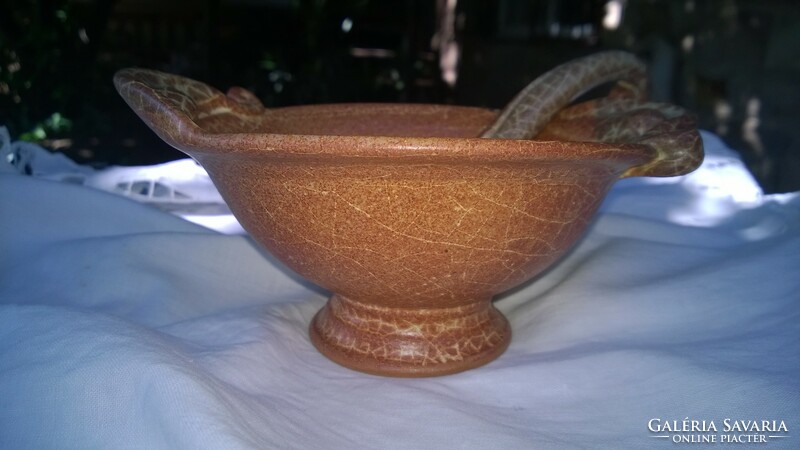 Roman style sauce-serving bowl with spoon on table decoration