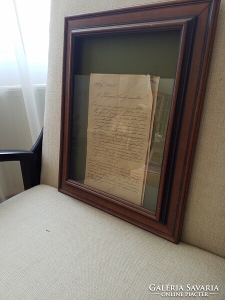 Court documents in open glass frame