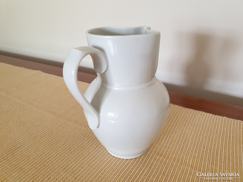 Old porcelain white jug folk vintage wine jug