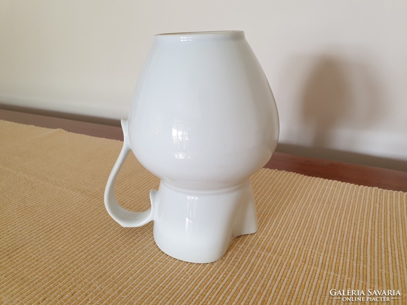 Old porcelain white jug folk vintage wine jug
