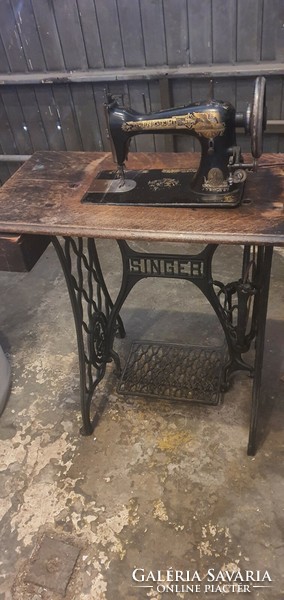 Singer sewing machine in very nice condition on a multifunction stand.