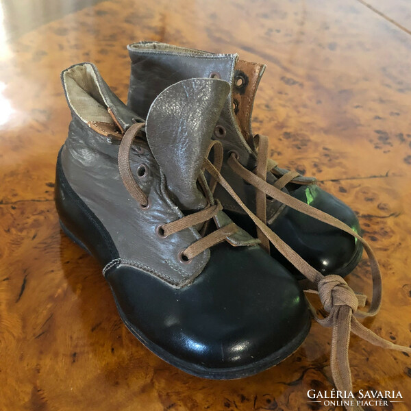Antique children's shoes 100 years old 