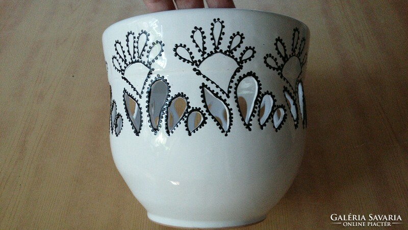 White ceramic pot with openwork black pattern