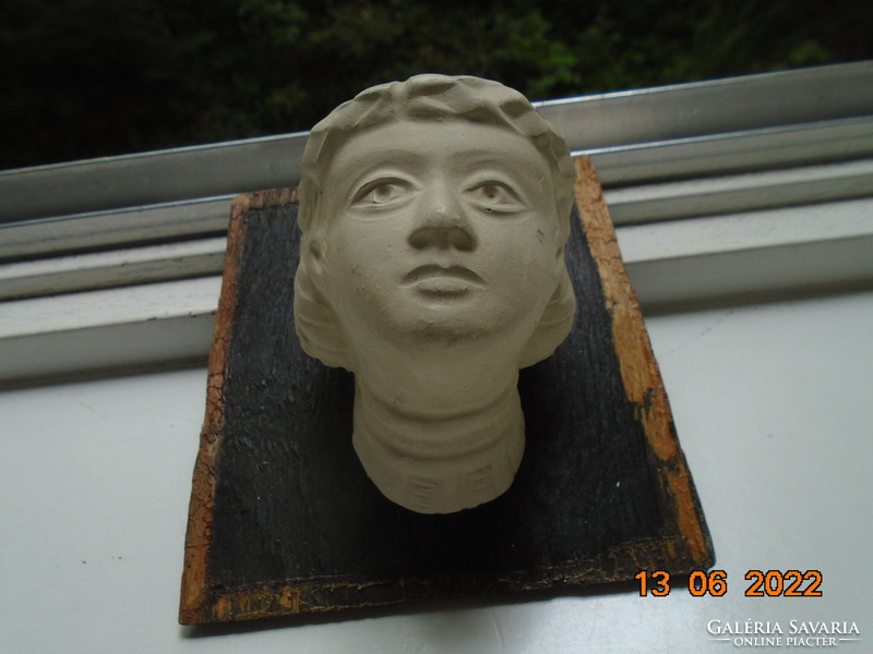 Female plaster head in ancient style with laurel wreath