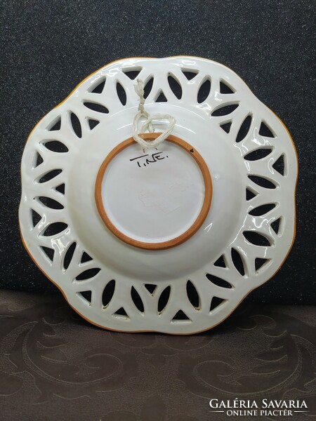 Ceramic decorative plate with folk floral pattern with pierced decoration