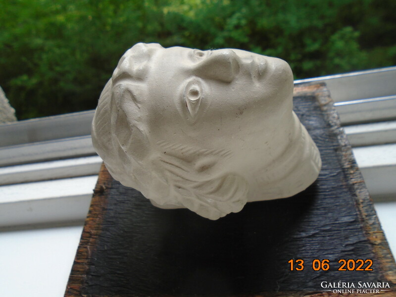 Female plaster head in ancient style with laurel wreath