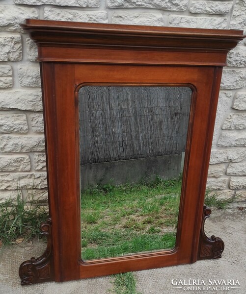 Antique wooden mirror from the 1800s, with a carved, faceted mirror. Neo-Baroque, Viennese Baroque