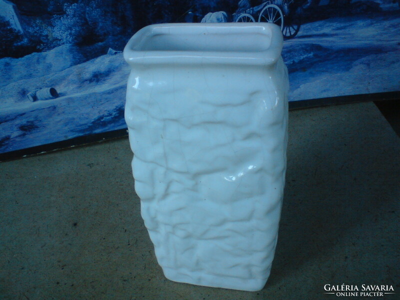 Old retro white ceramic craft vase