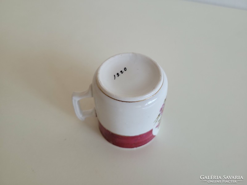 Old porcelain small mug with little girl's floral pattern