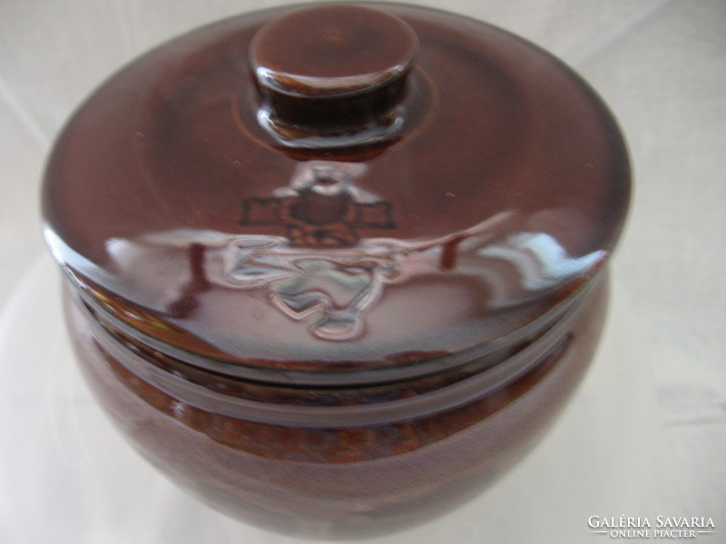 Brown jar with crowned teddy bear