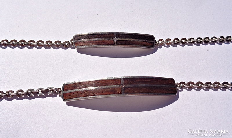 Pair of silver inlaid bracelets with diamond stones