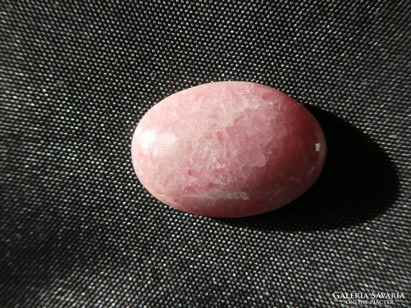 A piece of rhodochrosite, naturally polished. Jewelry base material. 4.75 Grams