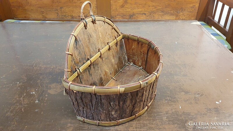 Old table or wall basket, flower stand. It is made by hand from wood shavings and bark