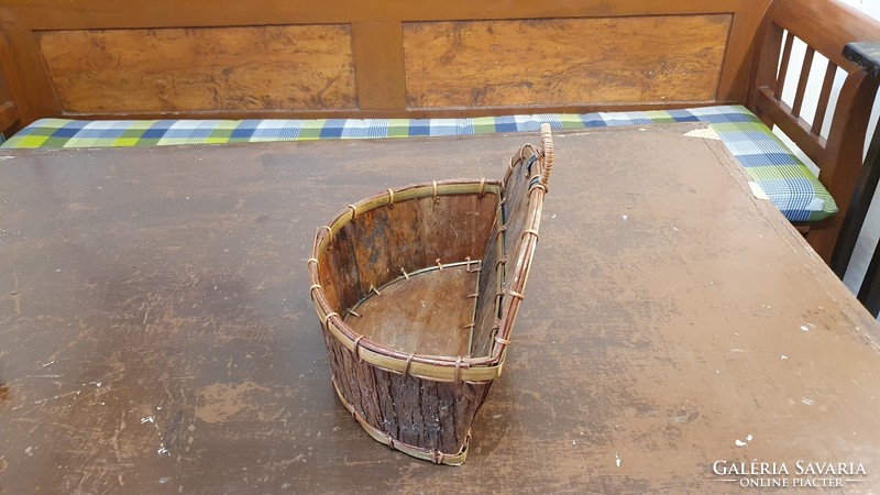 Old table or wall basket, flower stand. It is made by hand from wood shavings and bark