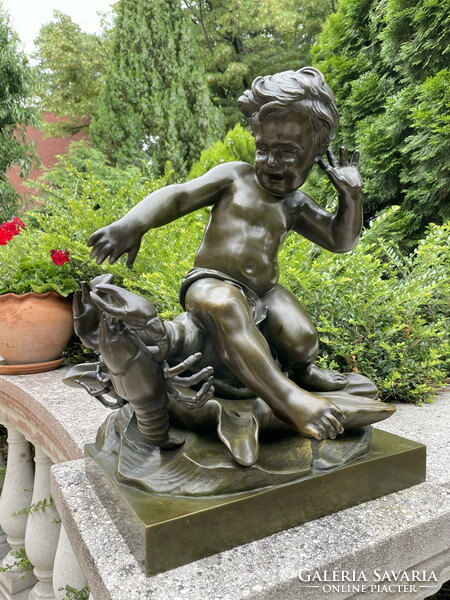 Pigalle: an antique bronze statue of a putto teasing a crab!!!!