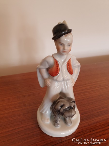 Old Herend porcelain boy in traditional costume with dog