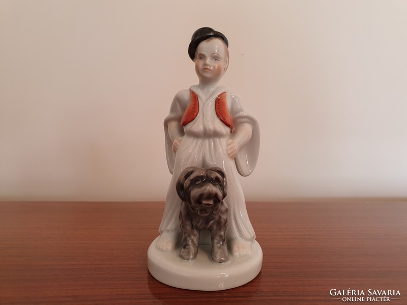 Old Herend porcelain boy in traditional costume with dog