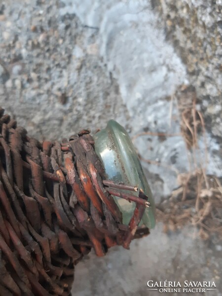 Glass bottle blown into an old shape, in cane braid