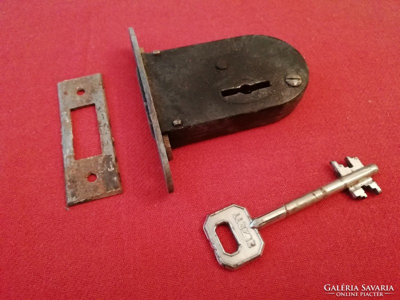 Antique thick patent lock with feather key against piece, rarity for sale