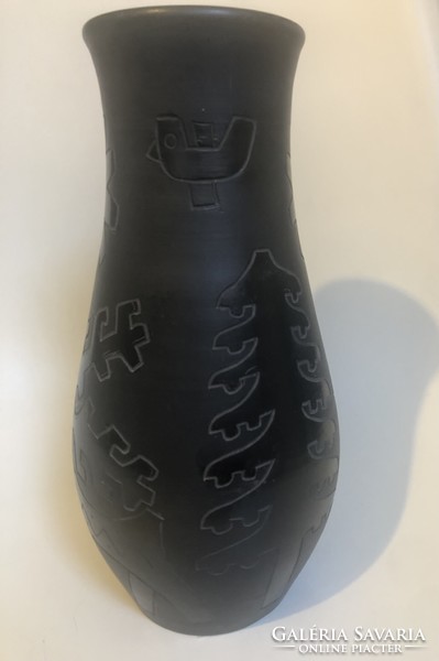 Black ceramic vase with beautiful symbols