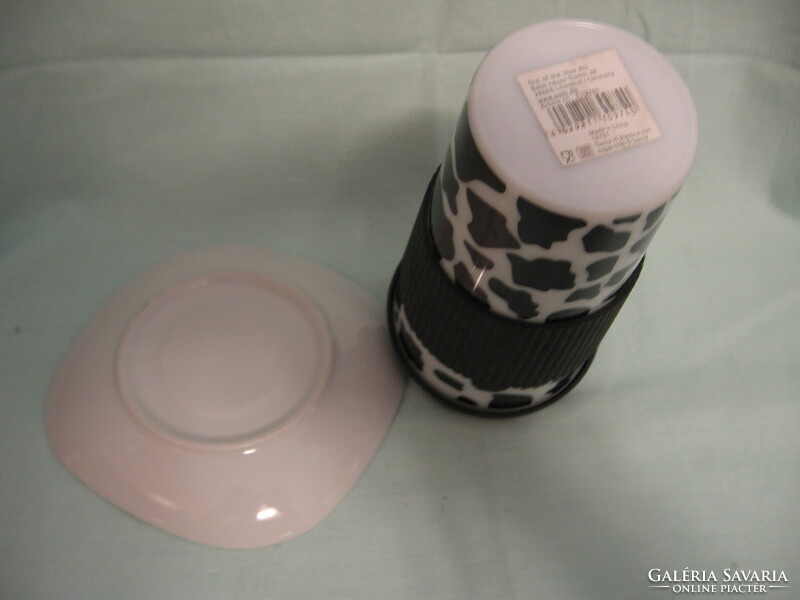 Black and white mug, plastic travel cup with cow pattern and porcelain coaster