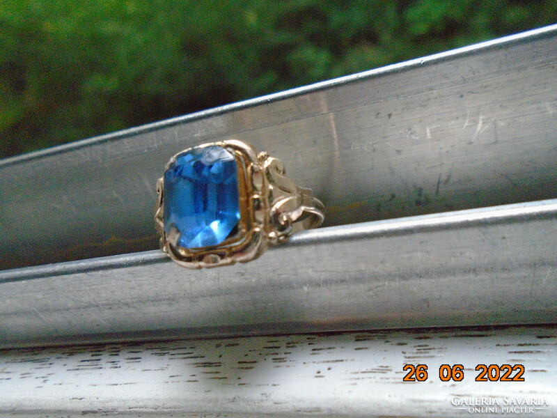 Silver-plated ring with a sapphire-colored polished stone
