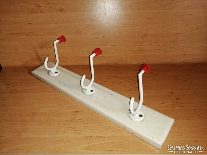 Retro aluminum hanger on a wooden stand