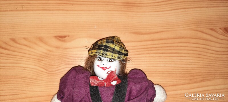 A clown with an old porcelain head