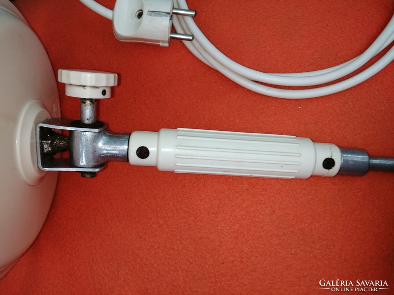 Old table lamp, infrared lamp, or workshop lamp.