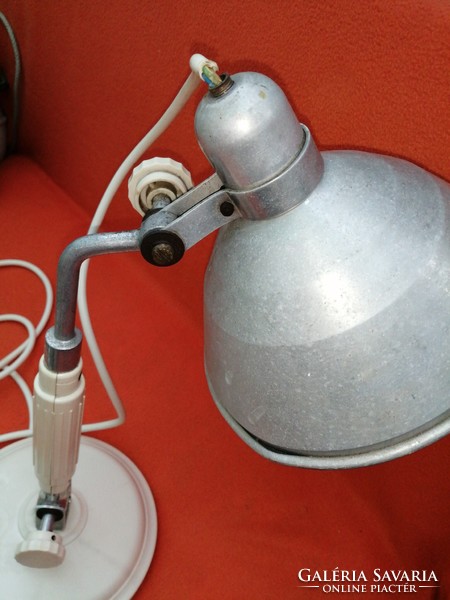 Old table lamp, infrared lamp, or workshop lamp.