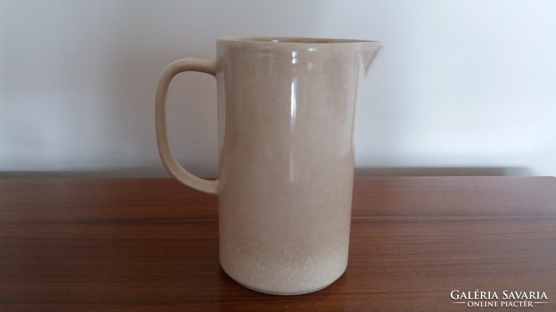 Old ceramic jug with cherry blossom spout