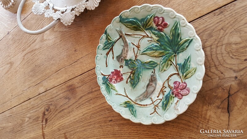 Antique French majolica plate with convex pattern and birds