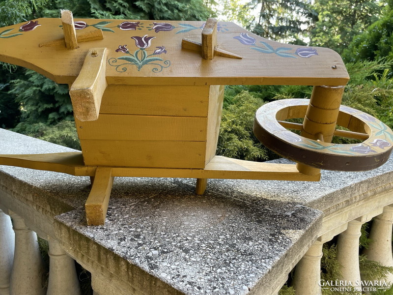 Garden wooden geranium wheelbarrow