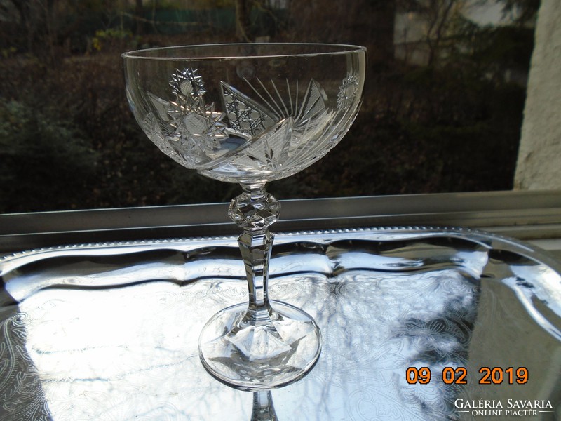 A crystal glass with a base with rich detailing