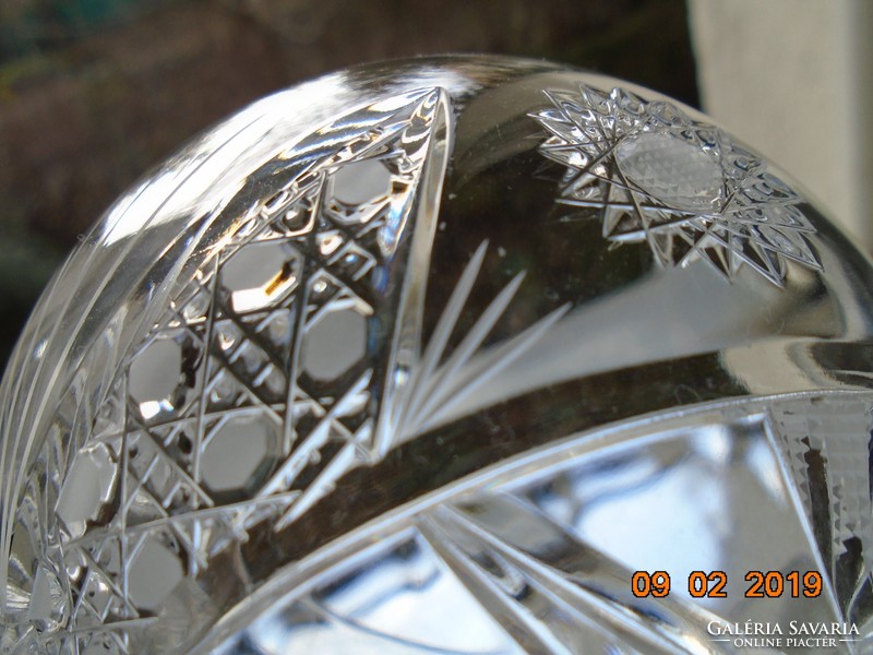 A crystal glass with a base with rich detailing
