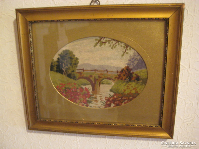 Old needle tapestry in a nice frame, with an oval golden passepartout 29 x 24 cm