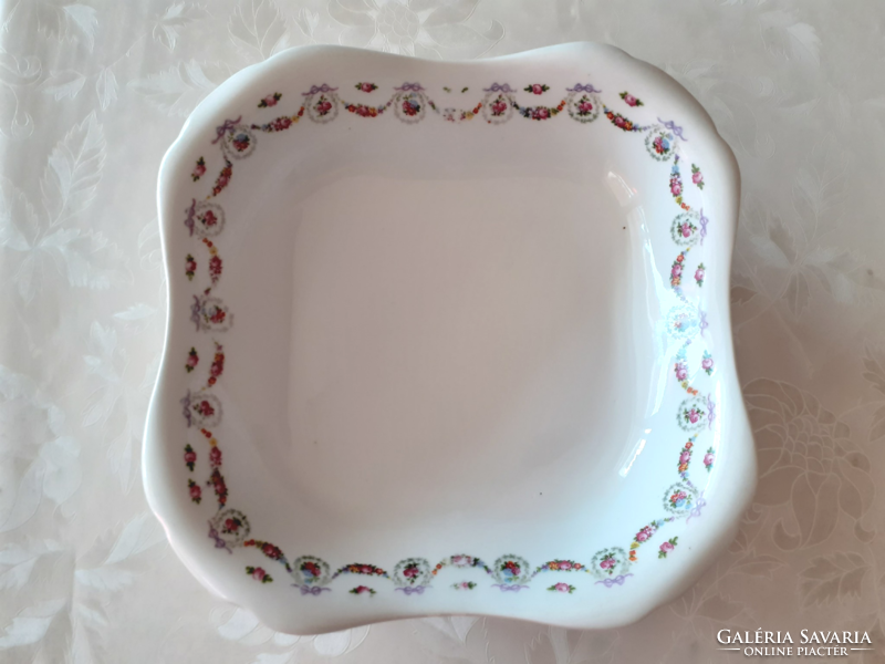 Old square rose-patterned porcelain bowl with flower garland and rose garnish