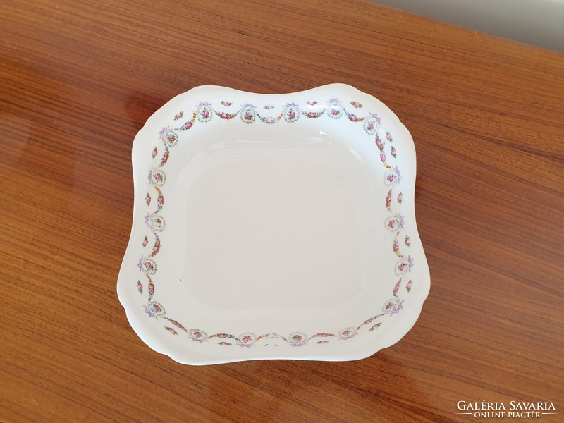 Old square rose-patterned porcelain bowl with flower garland and rose garnish