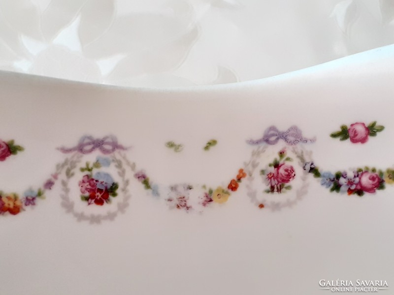 Old square rose-patterned porcelain bowl with flower garland and rose garnish