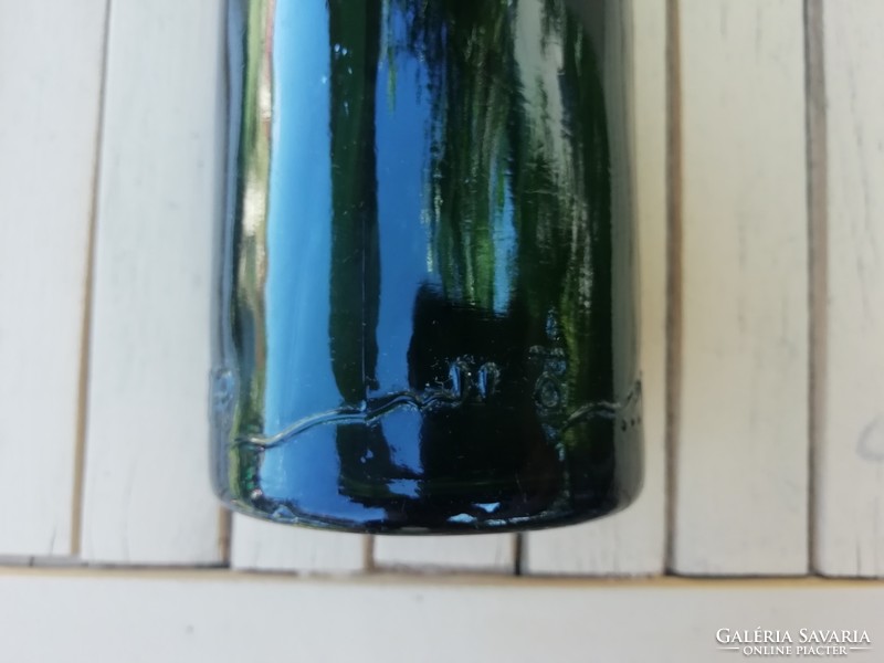 Old eagle beer glass bottle, in several languages