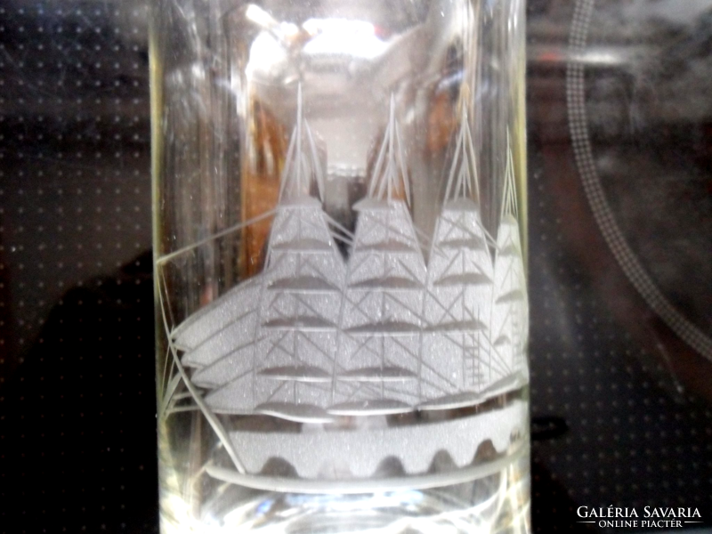 Polished glass with a picture of a sailing ship
