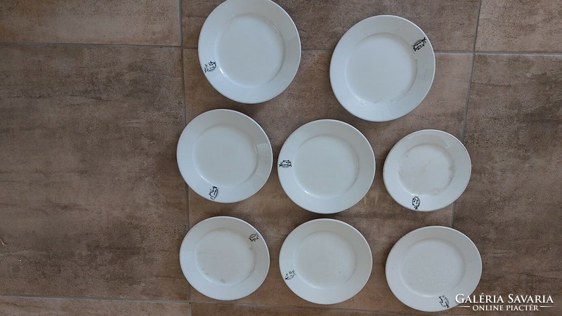 Antique porcelain plates with markings, of course in one..