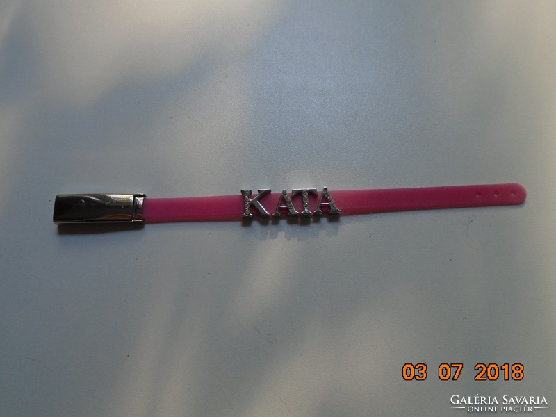 Modern pink wrist strap kata decorated with silver-plated, stone-encrusted letters