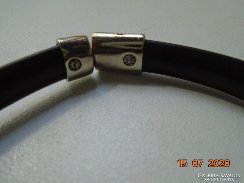 Modern black rubber wrist strap with chiseled silver-plated metal decoration