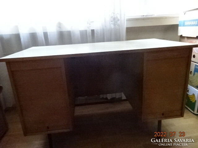 There is a wooden desk and a shutter door to cover the drawers. Hotel. It costs HUF 55/km!